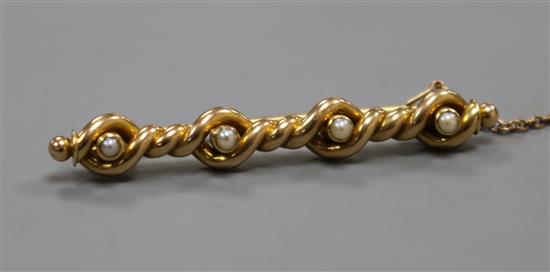 A yellow metal and seed pearl set spiral bar brooch, 45mm.